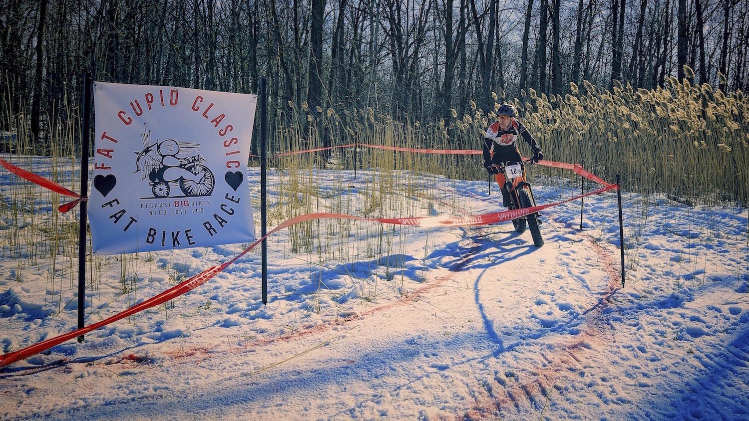 A fat bike racer rounds a corner during the Fat Cupid Classic held in Appleton Wisconsin.