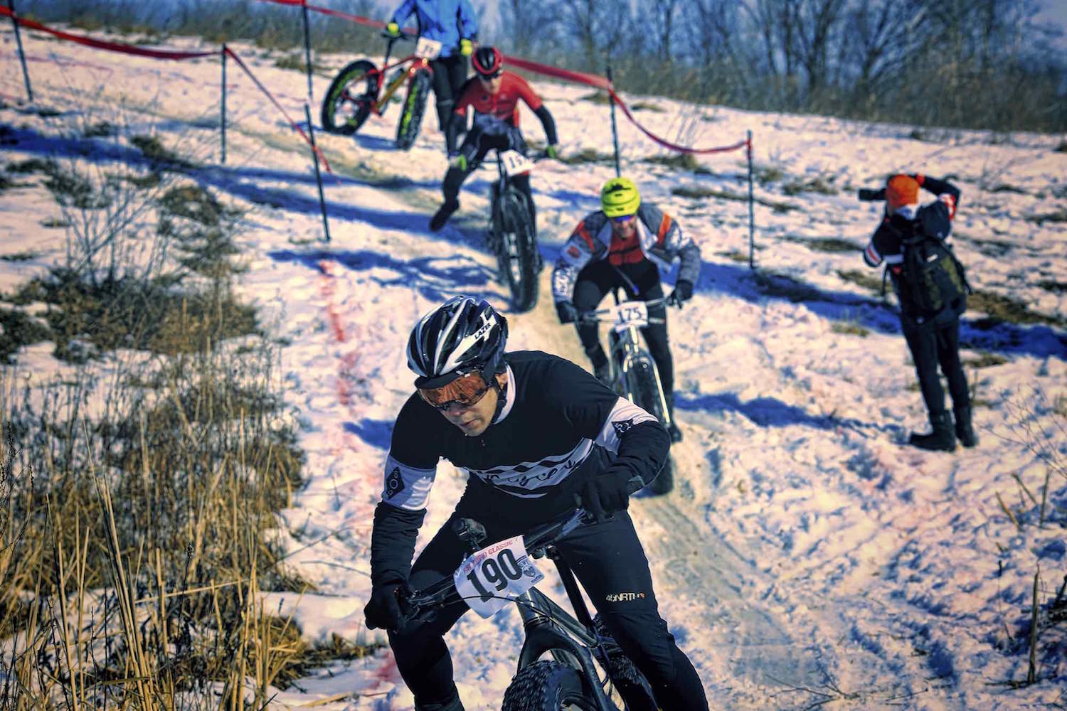 Fat bike racers tackle a slippery descent during the Fat Cupid Classic.